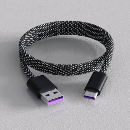 Self-Coiling Magnetic Charging Cable with Braided Protection and Interchangeable Tips