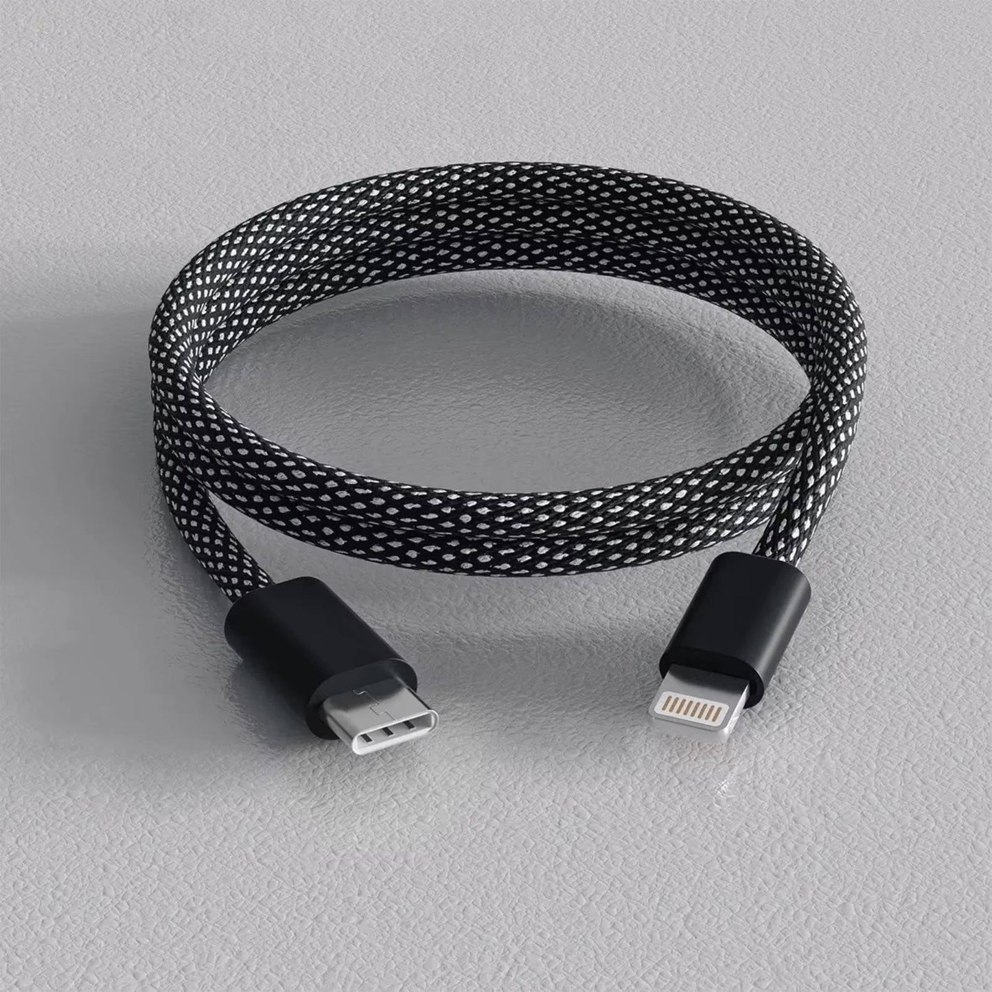 Self-Coiling Magnetic Charging Cable with Braided Protection and Interchangeable Tips