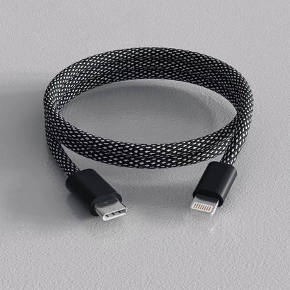 Self-Coiling Magnetic Charging Cable with Braided Protection and Interchangeable Tips
